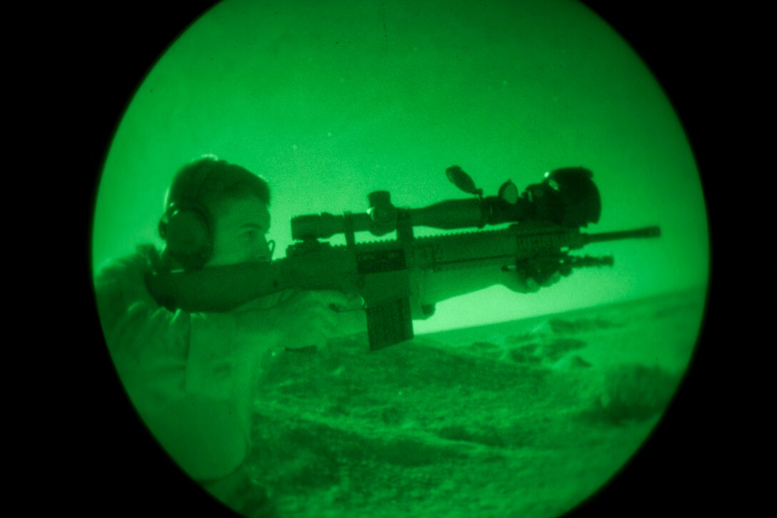 A 26th Marine Expeditionary Unit (MEU) Maritime Raid Force Marine fires an M110 Semi-Automatic Sniper System during a nighttime live fire in Jordan, June 21, 2013. Exercise Eager Lion 2013 is an annual, multinational exercise designed to strengthen military-to-military relationships and enhance security and stability in the region by responding to modern-day security scenarios. The 26th MEU is a Marine Air-Ground Task Force forward-deployed to the U.S. 5th Fleet area of responsibility aboard the Kearsarge Amphibious Ready Group serving as a sea-based, expeditionary crisis response force capable of conducting amphibious operations across the full range of military operations. (U.S. Marine Corps photograph by Sgt. Christopher Q. Stone, 26th MEU Combat Camera/Released)