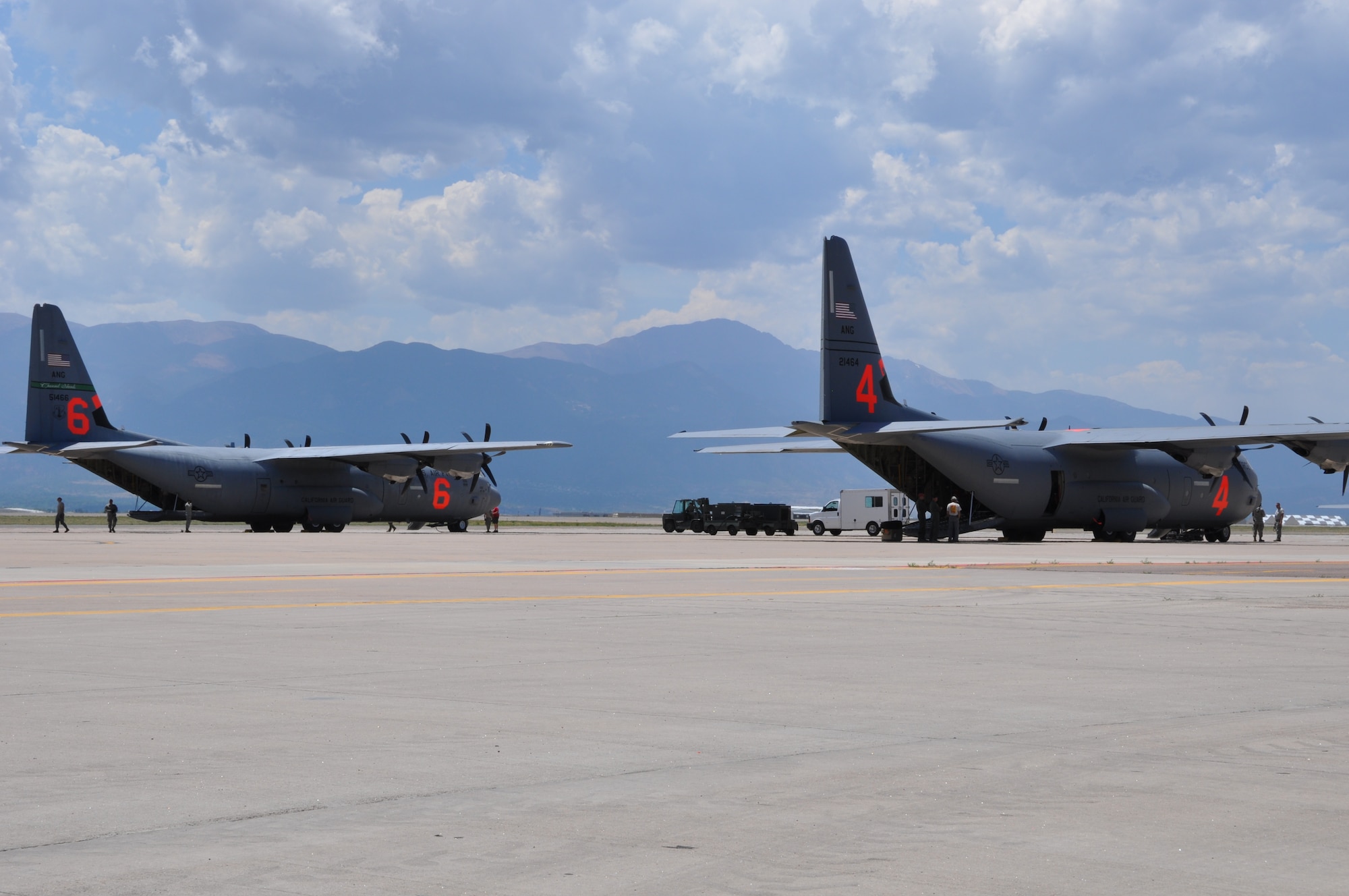 California Air National Guard's 'MAFFS 4' and 'MAFFS 6' arrive Peterson Air Force Base, Colo. June 23. The MAFFS capability increased from two to four C-130s with the arrival of the two C-130s from the 146th Airlift Wing. The U.S. Forest Service, through the National Interagency Fire Center in Boise, Idaho requested the activation of two additional Modular Airborne Fire Fighting System-equipped military C-130 aircraft to assist in battling wildland fires. (U.S. Air Force photo/Ann Skarban)
