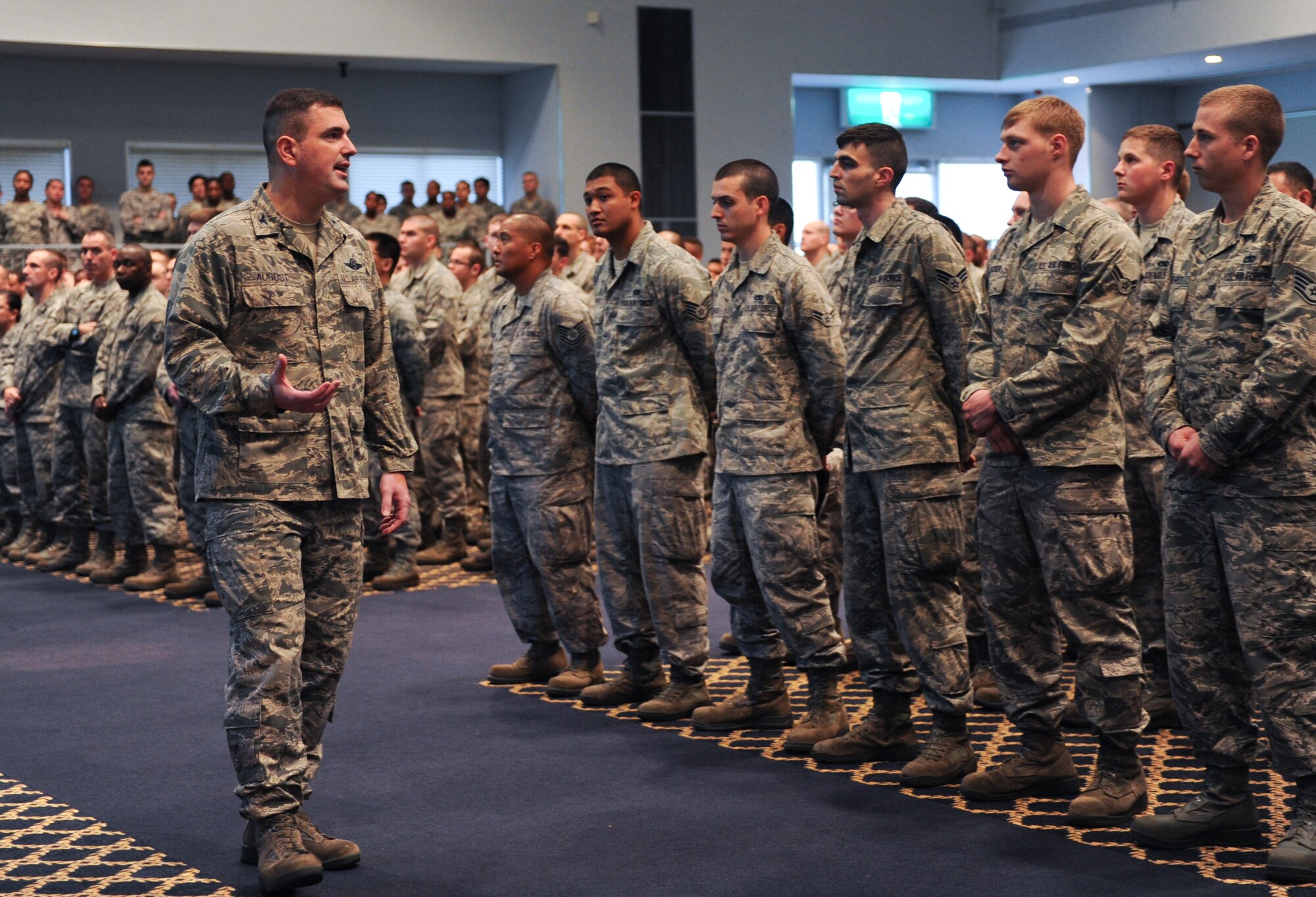 YOKOTA AIR BASE, Japan -- Col. Mark August, 374th Airlift Wing commander, addresses Airmen concerning sexual assault and prevention at the Taiyo Community Center, Yokota Air Base, Japan, June 21, 2013. August reinforced the Department of Defense's commitment to eliminate incidents of sexual assault through awareness and prevention training, education, victim advocacy, response, reporting and accountability. (U.S. Air Force photo by Senior Airman Andrea Salazar/Released)