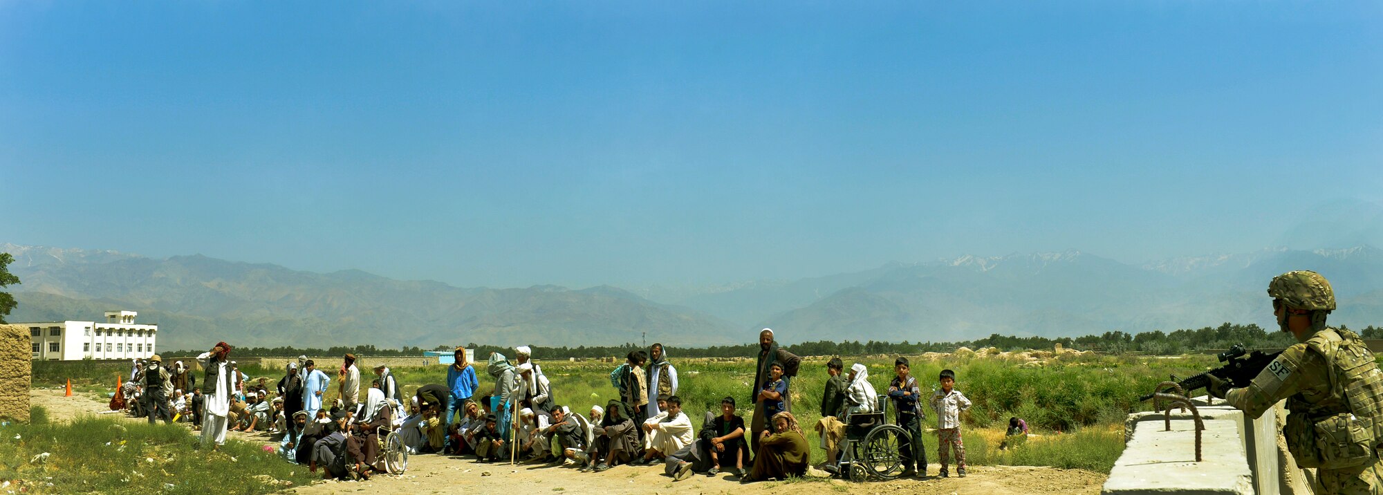 Local Afghan residents wait in a line outside for the Egyptian field hospital to open at Bagram Airfield, Afghanistan, June 22. The field hospital has been closed for the last month for renovations. The field hospital is operated by the Egyptian military, with security provided by Air Force security forces. The field hospital, which opened its door in 2003, today treats more than 7,000 Afghans per month including women and children. (U.S. Air Force photo/ Staff Sgt. Stephenie Wade)