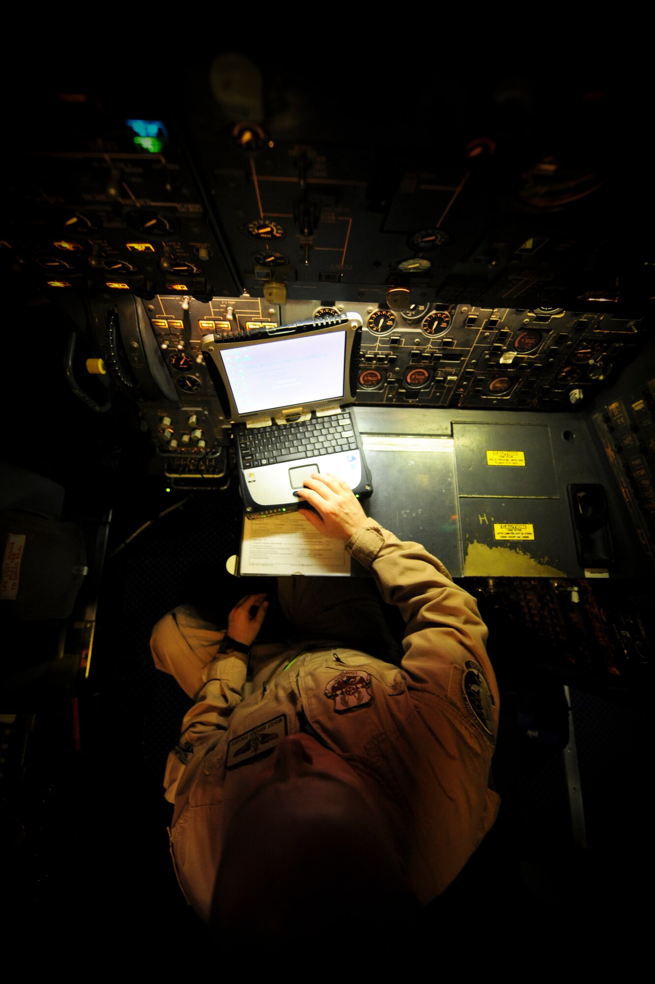 U.S. Air Force Master Sergeant Brian Fahey, 908th Expeditionary Air Refueling Squadron flight engineer, re-engages the GPS system for KC-10 Extender prior to flight at an undisclosed location in Southwest Asia June 14, 2013. This combat sortie marked Fahey’s 400th combat mission as a flight engineer. Fahey hails from Lakewood N.J., and is deployed from Joint Base McGruire-Dix-Lakehurst, N.J. (U.S. Air Force photo by Staff Sgt. Joshua J. Garcia)
