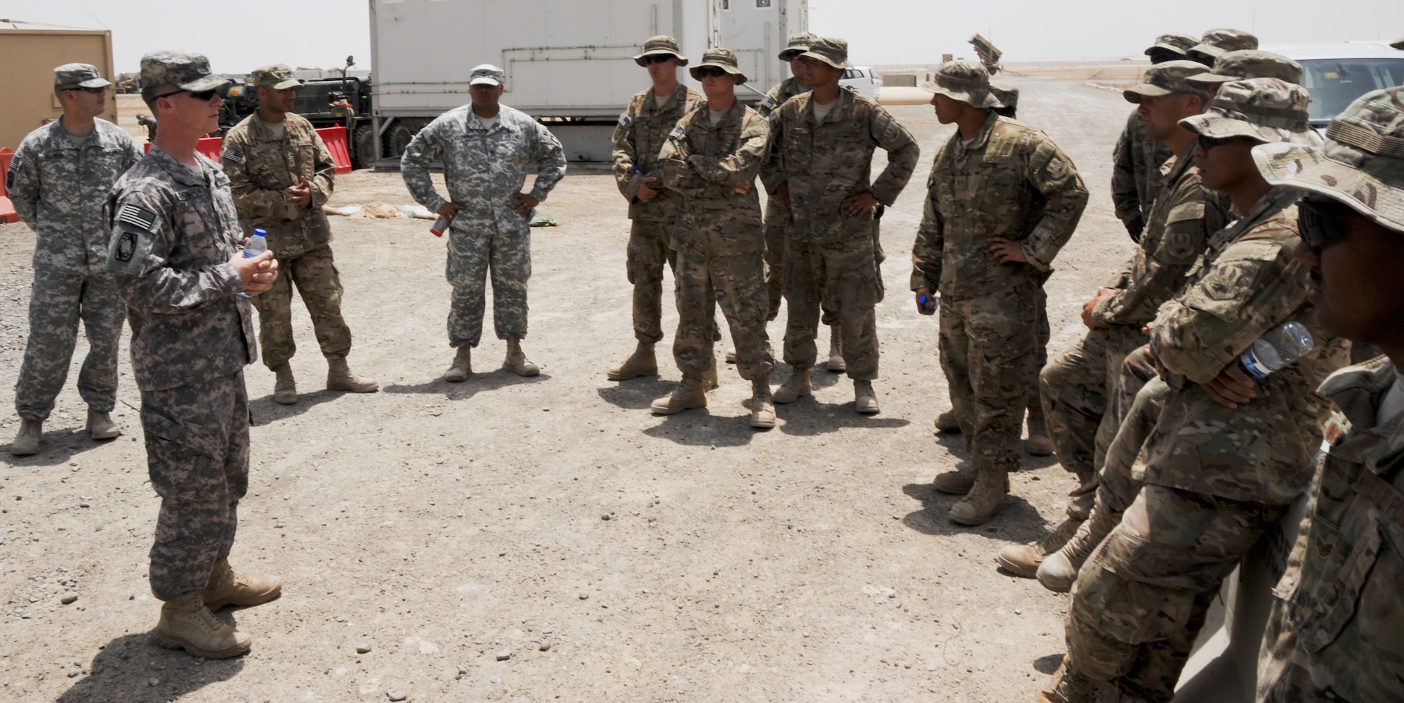U.S. Army 1st Lt. Ryan Thompson, 1-62 Air Defense Artillery Battalion tactical control officer, briefs members of the 380th Air Expeditionary Wing during a tour of a Patriot missile site at an undisclosed location in Southwest Asia June 14, 2013. The 1-62 ADA BN mission is to intercept tactical ballistic missiles in defense of the base, which is integrated into operations with the Air Force. The tour of the 1-62 ADA BN’s Patriot site was part of the Army’s 238th Birthday celebration. (U.S. Air Force photo by Senior Airman Jacob Morgan)
