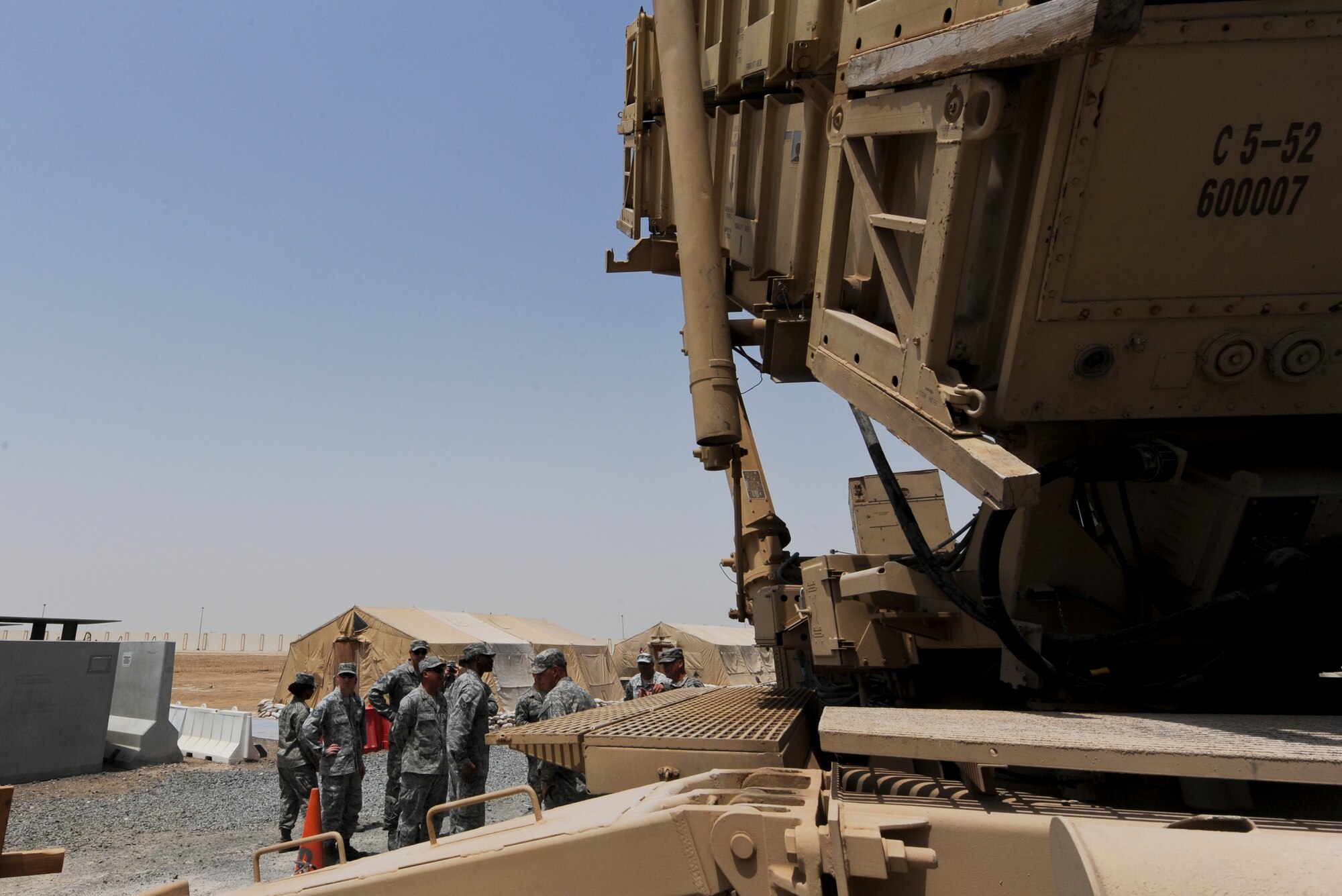 Members of the 380th Air Expeditionary Wing receive a tour of a Patriot missile site operated by the 1-62 Air Defense Artillery Battalion at an undisclosed location in Southwest Asia June 14, 2013. The 1-62 ADA BN mission is to intercept tactical ballistic missiles in defense of the base, which is integrated into operations with the Air Force. The tour of the 1-62 ADA BN’s Patriot site was part of the Army’s 238th Birthday celebration. (U.S. Air Force photo by Senior Airman Jacob Morgan)