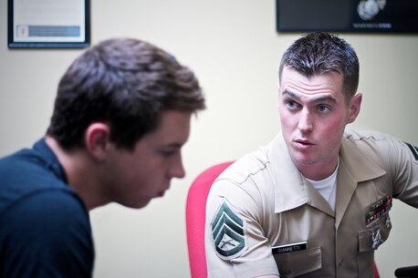Marine Corps recruiter Staff Sgt. Christopher Giannetti, with Recruiting Substation Naples, Recruiting Station Fort Lauderdale, Fla., speaks with a prospective Marine about opportunities and benefits during a follow up interview June 12, 2013. Giannetti has made 15 Marines during his time as a canvasing recruiter, two of which became platoon honor graduates during boot camp. 