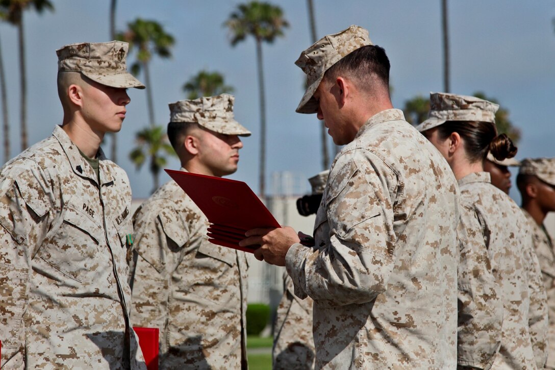 Marines with the Command Element, 15th Marine Expeditionary Unit, during an awards ceremony held on the Camp Del Mar Parade Deck, Camp Pendleton, Calif., June 17. The 15th MEU recently returned from a West Pac 12-2 deployment. (U.S. Marine Corps photo by Cpl. Emmanuel Ramos/Released)