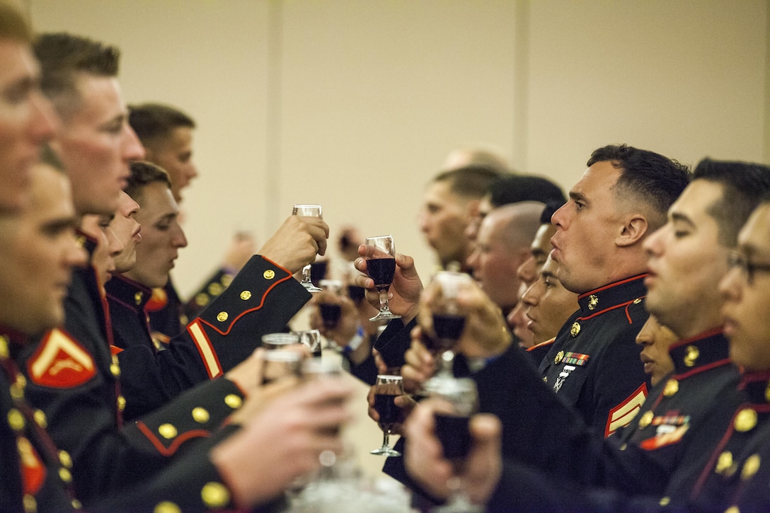 Marines of Marine Air Control Squadron 1 toast the memory of Marines past at the MACS-1 Mess Night on Marine Corps Air Station Yuma, Ariz., at the Sonoran Pueblo, June 7. The Mess Night is a Marine Corps tradition that brings a unit together for an evening of dining and camaraderie.