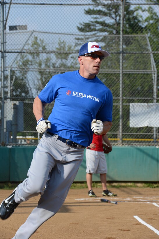 Matthew Erickson, Officer Candidates School team Extra Hitters left fielder, runs past first base during the intramural softball season opener on Marine Corps Base Quantico was held on June 17, 2013, at the Field of Dreams 1 and 2. OCS beat the Legal Services Support Section, 18-3.
