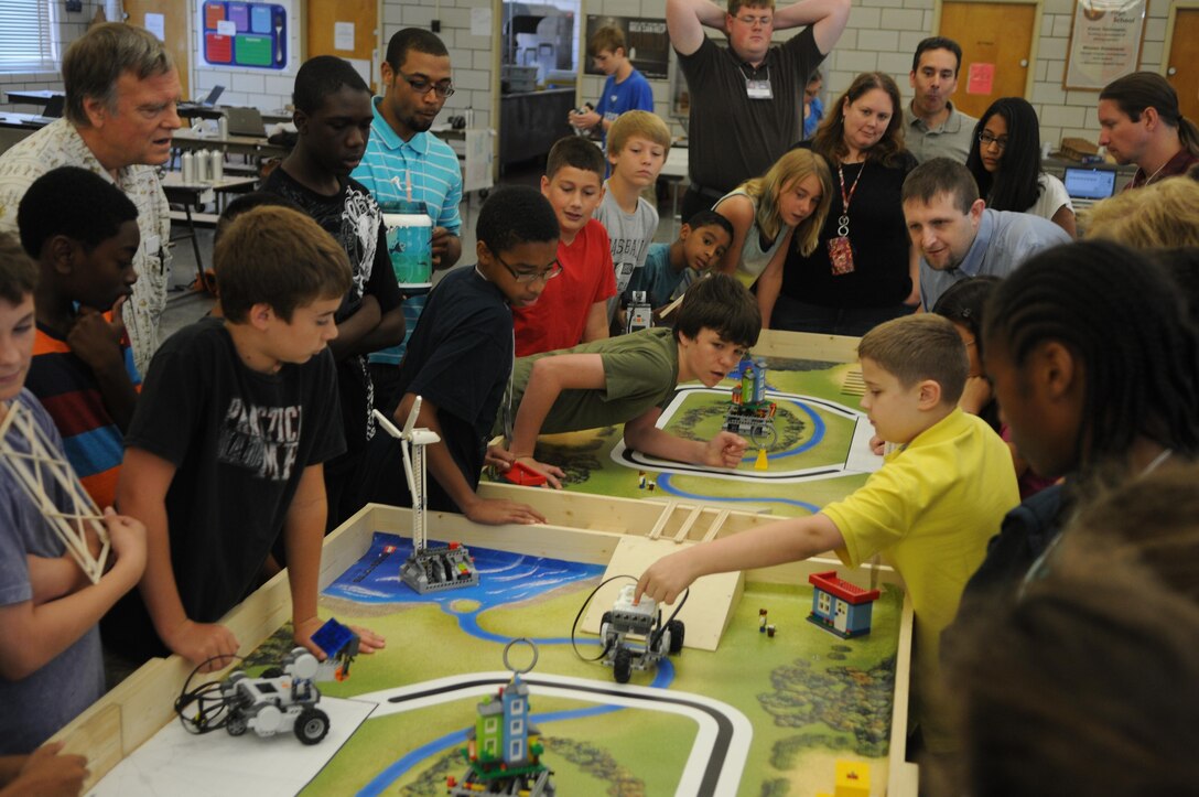 Rising seventh-grader Mackenzie prepares to test his team’s balsa wood bridge at Quantico Middle/High School’s summer Science, Technology, Engineering and Math Academy on June 21, 2013. 
