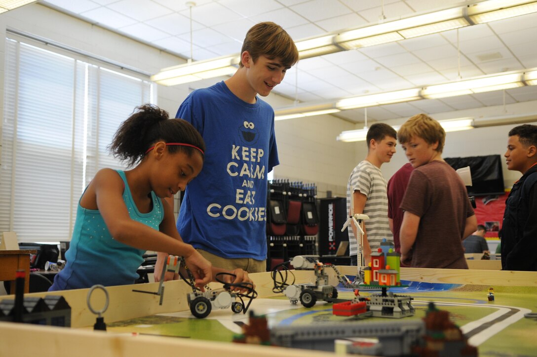Rising seventh-grader Ania, left, and rising ninth-grader Jackson fine-tune their  LEGO robots on the morning of June 21, 2013, at Quantico Middle/High School’s weeklong Science, Technology, Engineering and Math Academy. 