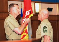 BGen Mark R. Wise (left) passes the Marine Corps Warfighting Lab’s colors to MGySgt. Larry E. Deyott as he relinquishes command of the Marine Corps Warfighting Laboratory at a change of command ceremony held at the Gray Research Center aboard Marine Corps Base Quantico.