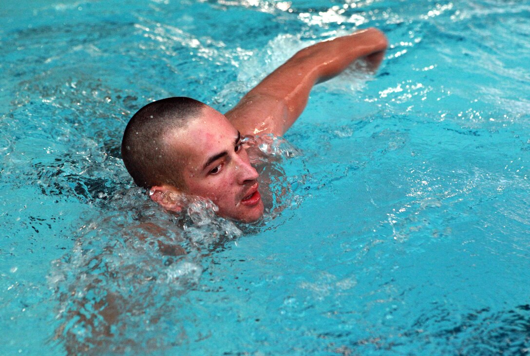 Cpl. Vincent Moore, radio technician, Headquarters Platoon, Lima Company, 3rd Battalion, 3rd Marine Regiment, Marine Rotational Force - Darwin, swims across a pool during a Corporals Course physical training session, here, June 21. The course provides corporals with the education and skills necessary to lead Marines. Two Australian soldiers and a Navy corpsman enrolled in the course to further their Marine Corps knowledge.