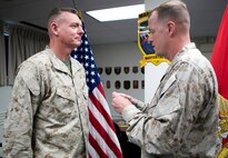 BGen Mark R. Wise, (right) Commanding General, Marine Corps Warfighting Laboratory prepares to pin the Bronze Star Medal on Col. John H. Lister (left), the Lab’s Senior Liaison Officer for Counter-Improvised Explosive Devices at the Joint Improvised Explosive Device Defeat Organization. Col. Lister was awarded the Bronze Star for his actions while assigned to the I Marine Expeditionary Force (Forward) in Afghanistan.