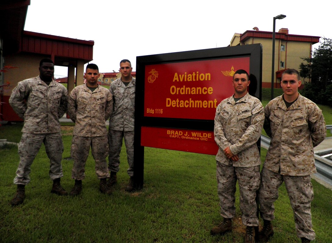 (From left) U.S. Marine Corps Lance Cpl. Detrick Milton, Lance Cpl. Brandon Hodges, Cpl. Zachariah Riley, Lance Cpl. Brent Nelson, and Lance Cpl. Adam Donahue, rushed to the aid of a motorist trapped inside a cargo truck June 7 after witnessing the fully-loaded truck take a turn too fast, roll-over and skid off the road near Chinhae, South Korea.  The Marines from the U.S. Marine Corps Forces Korea Aviation Ordinance Detachment cut the seatbelt to free the trapped driver, moved him to safety and performed first aid to treat profuse bleeding and other injuries.