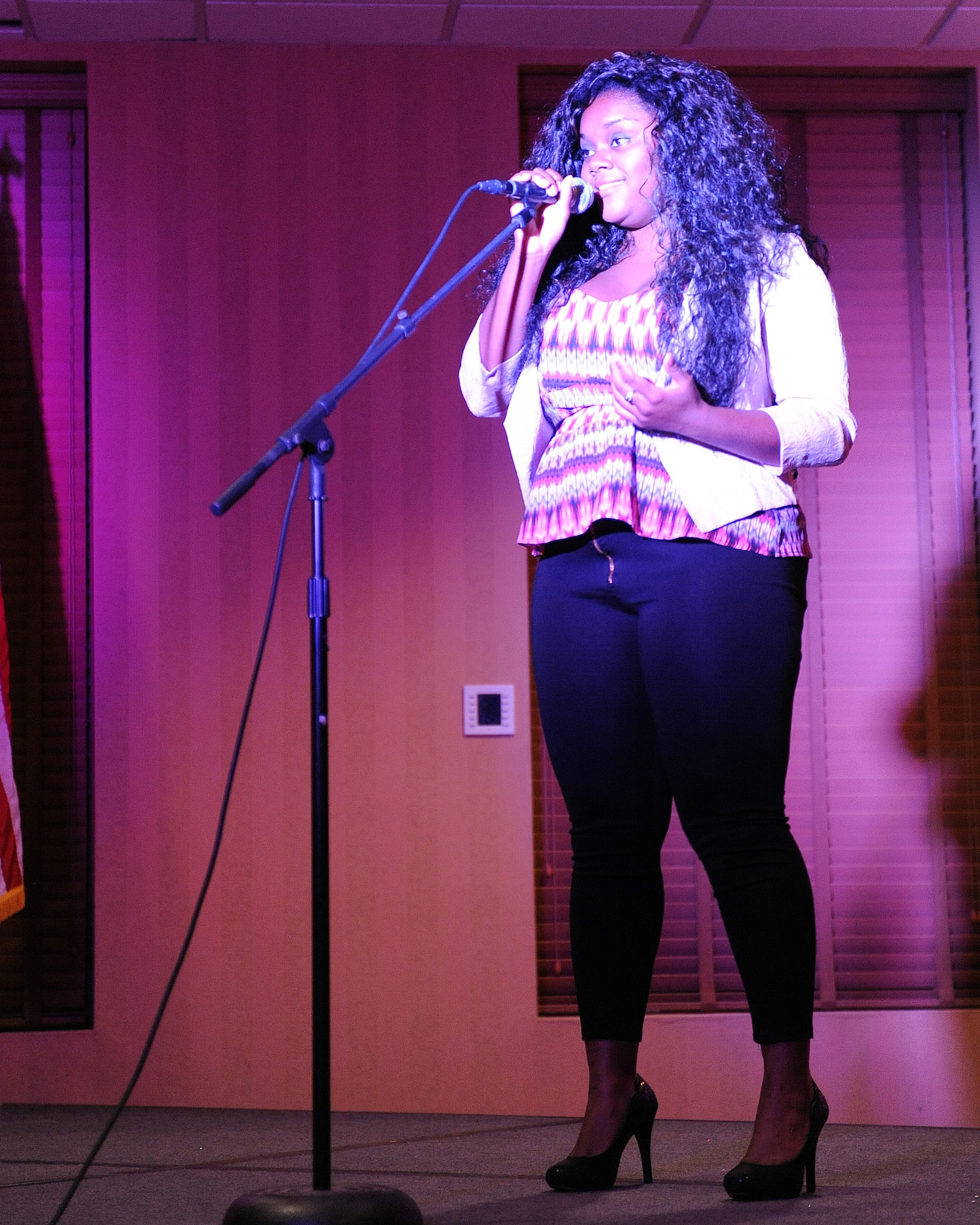 U.S. Air Force Airman 1st Class Saphfire Cook, 355th Fighter Wing, sings Beyonce’s ‘Halo’ during D-M’s Got Talent at Davis-Monthan Air Force Base, Ariz., June 20, 2013. Cook received first place for her performance. (U.S. Air Force photo by Senior Airman Christine Griffiths/Released) 