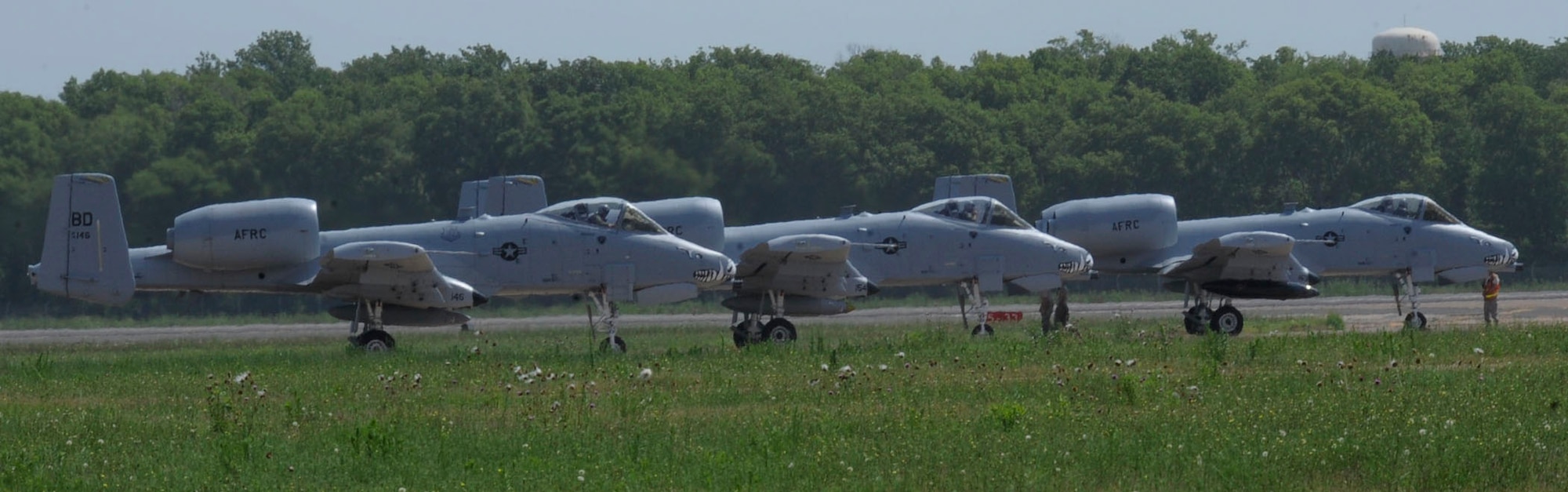 The final three A-10 Thunderbolt II attack aircraft conduct final checks before take off on Barksdale Air Force Base, La., June 24, 2013. Specifically designed for close air support, its combination of large and varied ordnance load, long loiter time, accurate weapons delivery, austere field capability, and survivability has proven invaluable to the United States and its allies.The A-10s departed after more than 3 decades on Barksdale. (U.S. Air Force photo)(Senior Airman Kristin High)