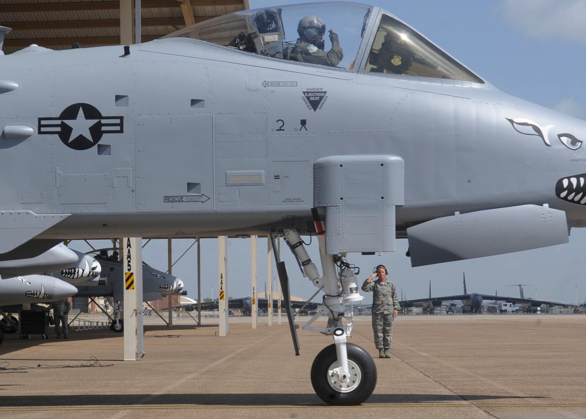 Col. John Breazeale, 917th Fighter Group commander, and Tech. Sgt. Rikki Welch, 917th FG crew chief, salute before take off on Barksdale Air Force Base, La., June 24, 2013. The final three A-10s departed after 33 years on Barksdale, returning to Davis-Monthan AFB, Ariz., where the first A-10A was delivered in October 1975.(U.S. Air Force photo)(Senior Airman Kristin High)