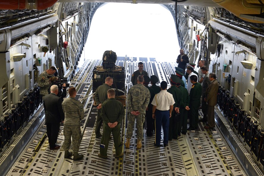 Capt. Kyle Clinton, 62nd Airlift Wing weapons and tactics director, explains the joint precision airdrop system to Senior Lt. Gen. Do Ba Ty, Vietnam People’s Army Chief of the General Staff and Socialist Republic of Vietnam Vice Minister of the National Defense, and other Vietnamese military officials during a tour June 19, 2013 at Joint Base Lewis-McChord, Wash. Ty’s visit to JBLM helps to strengthen U.S. international partnerships and allowed his delegation to gain a greater understanding of the I Corps and 62nd Airlift Wing’s missions. (U.S. Air Force photo/Airman 1st Class Jacob Jimenez)