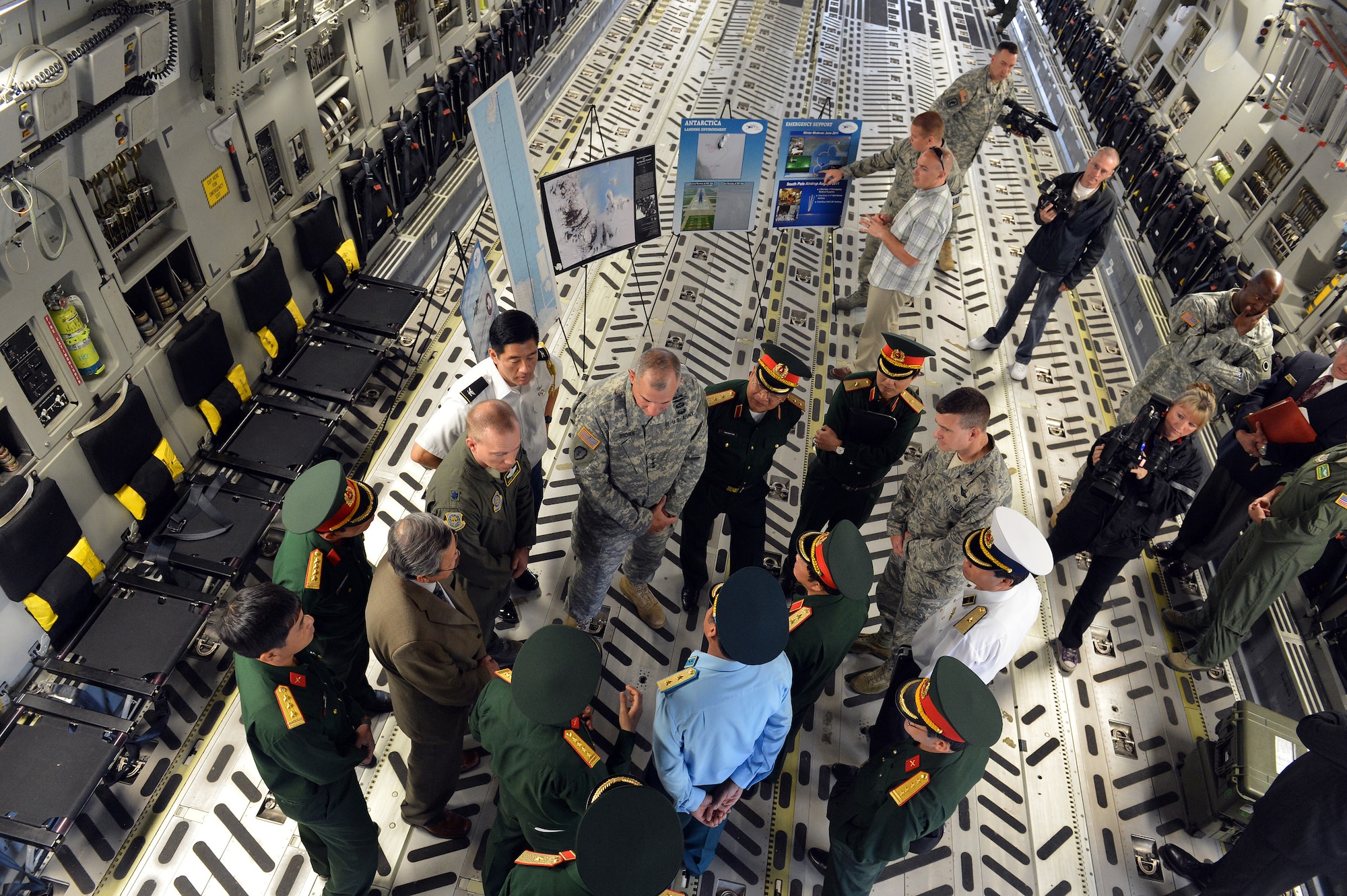 Senior Lt. Gen. Do Ba Ty, Vietnam People’s Army Chief of the General Staff and Socialist Republic of Vietnam Vice Minister of the National Defense, and other Vietnamese military officials learn about the different capabilities of the C-17 Globemaster III aircraft with Lt. Col. Brent Keenan, 62nd Operations Group deputy commander, during a tour June 19, 2013 at Joint Base Lewis-McChord, Wash. (U.S. Air Force photo/Airmen 1st Class Jacob Jimenez)