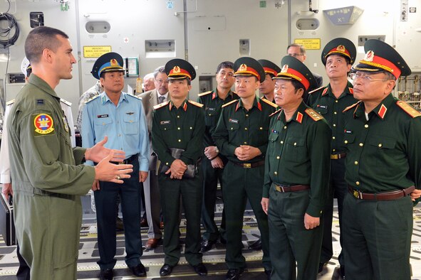 Capt. Kyle Clinton, 62nd Airlift Wing weapons and tactics director, briefs Senior Lt. Gen. Do Ba Ty, Vietnam People’s Army Chief of the General Staff and Socialist Republic of Vietnam Vice Minister of the National Defense, and other Vietnamese military officials on the airdrop capabilities of a C-17 Globemaster III aircraft during a tour June 19, 2013 at Joint Base Lewis-McChord, Wash. (U.S. Air Force photo/Airman 1st Class Jacob Jimenez)