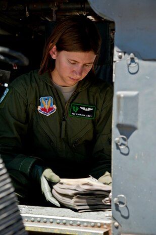 Airman 1st Class Natasha Libby, 66th Rescue Squadron aerial gunner, reviews a preflight checklist aboard an HH-60 Pave Hawk June 20, 2013, at Nellis Air Force Base, Nev.  In addition to being a critical preflight step, the checklist can also serve as a study guide for aircrew members’ on-the-job training. (U.S. Air Force photo by Senior Airman Daniel Hughes)