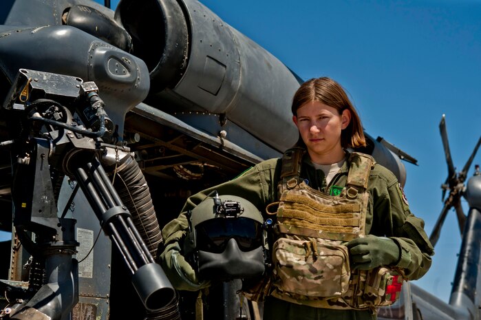Airman 1st Class Natasha Libby, 66th Rescue Squadron aerial gunner, stands next to an HH-60 Pave Hawk June 20, 2013, at Nellis Air Force Base, Nev. Libby is the only female among more than 30 gunners assigned to the 66th RQS. (U.S. Air Force photo by Senior Airman Daniel Hughes)