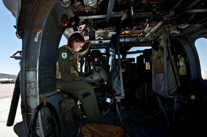 Airman 1st Class Natasha Libby, 66th Rescue Squadron aerial gunner, reflects on her life and decision to join the Air Force in an HH-60 Pave Hawk during an interview June 20, 2013, at Nellis Air Force Base, Nev. Growing up on her parents’ farm in Yakima, Wash., Libby’s upbringing instilled morals tantamount to the Air Force’s Core Values. (U.S. Air Force photo by Senior Airman Daniel Hughes)