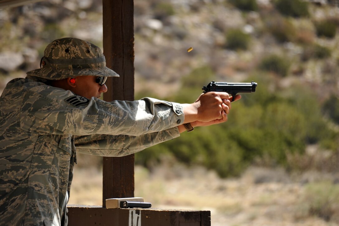An Airman fires at a target at during a May 17 shooting competition at Coyote Canyon. Anyone purchasing firearms at the new Exchange should know the rules for transporting and safeguarding weapons on base. (File photo by Ken Moore)