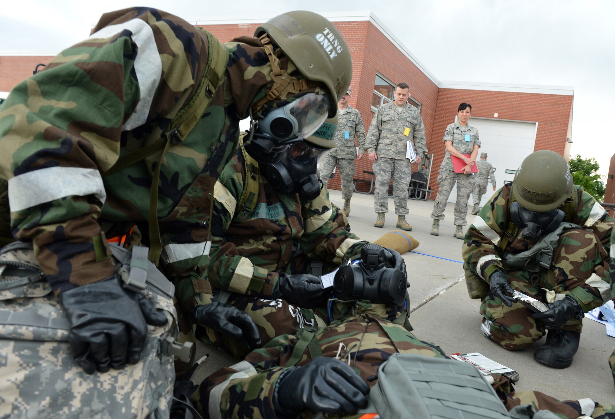 Members of the Nebraska Air National Guard’s 155th Air Refueling Wing participate in an Ability to Survive and Operate exercise at the Nebraska National Guard air base in Lincoln, Neb., June 11, 2013. The 155th ARW participated in the ATSO to evaluate and improve their capabilities and skills in a wartime scenario. (U.S. Air National Guard photo by Senior Airman Mary Thach/Released)