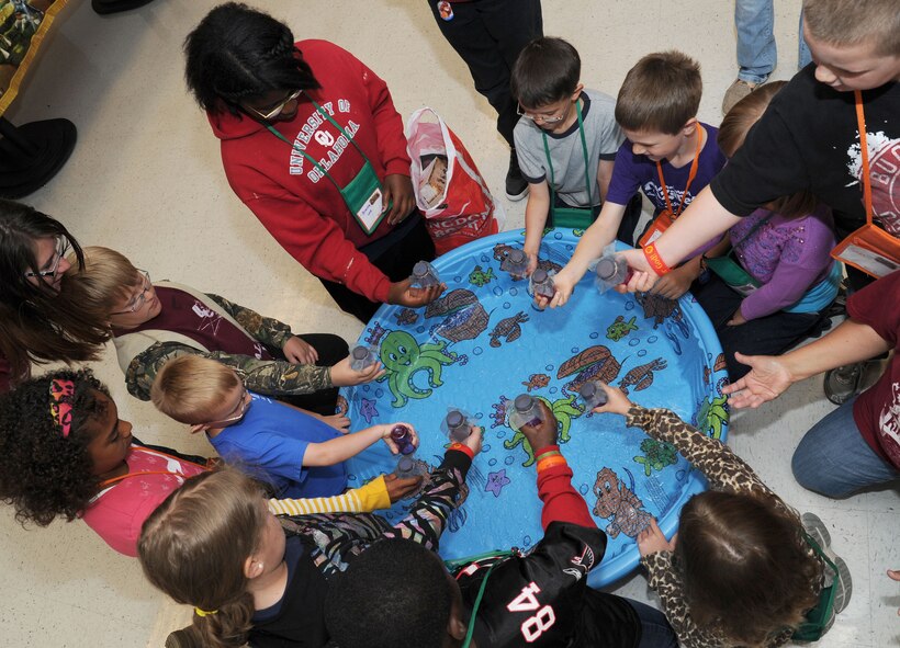 Summer Vacation Bible School kids participate in a project during the Summer Vacation Bible School at Fairchild Air Force Base, Wash., June 20, 2013. There were over 50 volunteers who helped with all the events and provided food for the children. (U.S. Air Force photo by Airman 1st Class Janelle Patiño/Released)