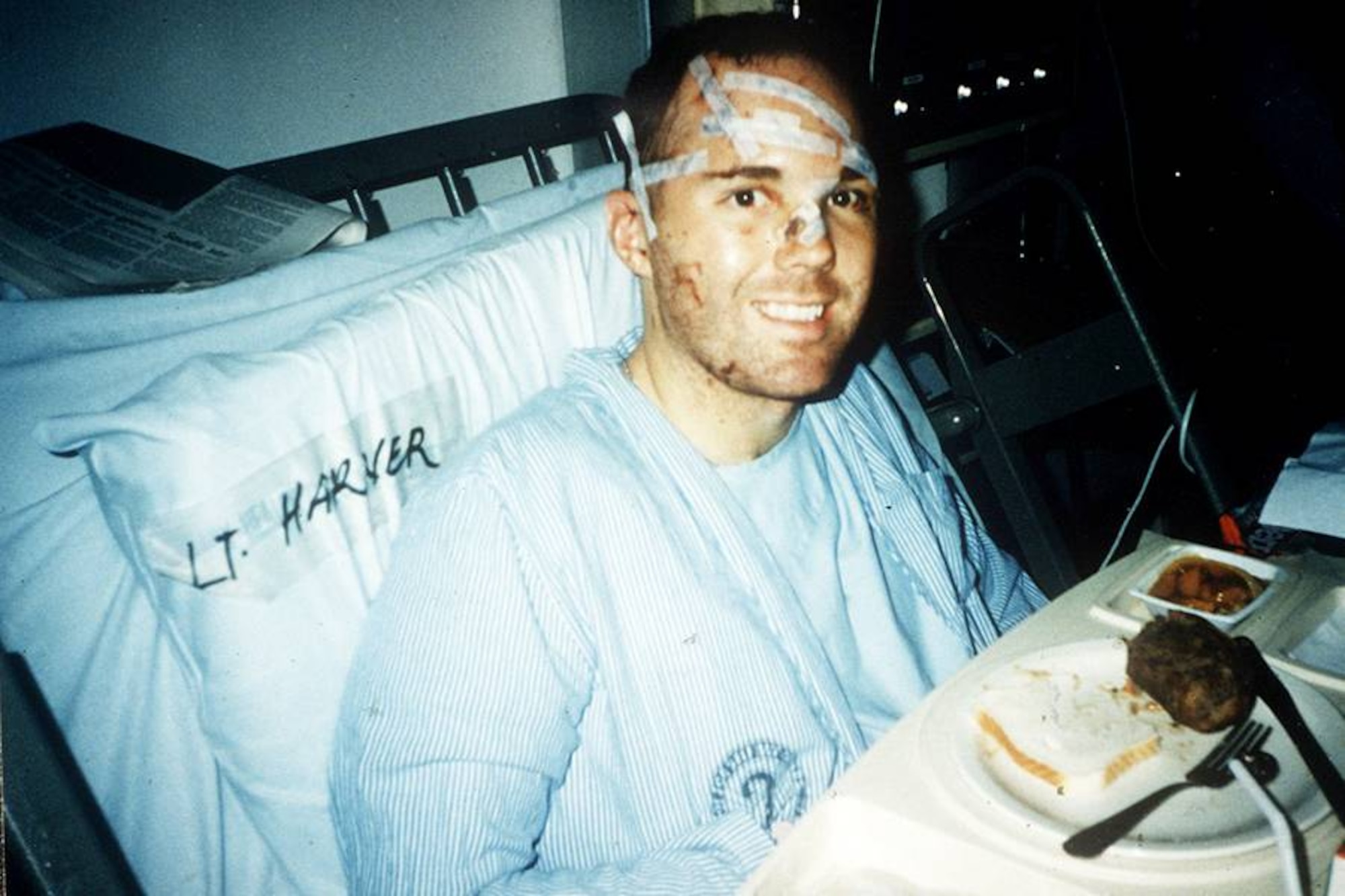 Then 1st Lt. Michael Harner smiles for the camer in a hospital bed while recovering from injuries sustained in the bombing of Khobar Towers in Dhahran, Saudi Arabia on June 25, 1996. Lt. Col. Michael Harner is now on his fourth deployment as the commander of the 577th Expeditionary Prime BEEF Squadron. (courtesy photo)