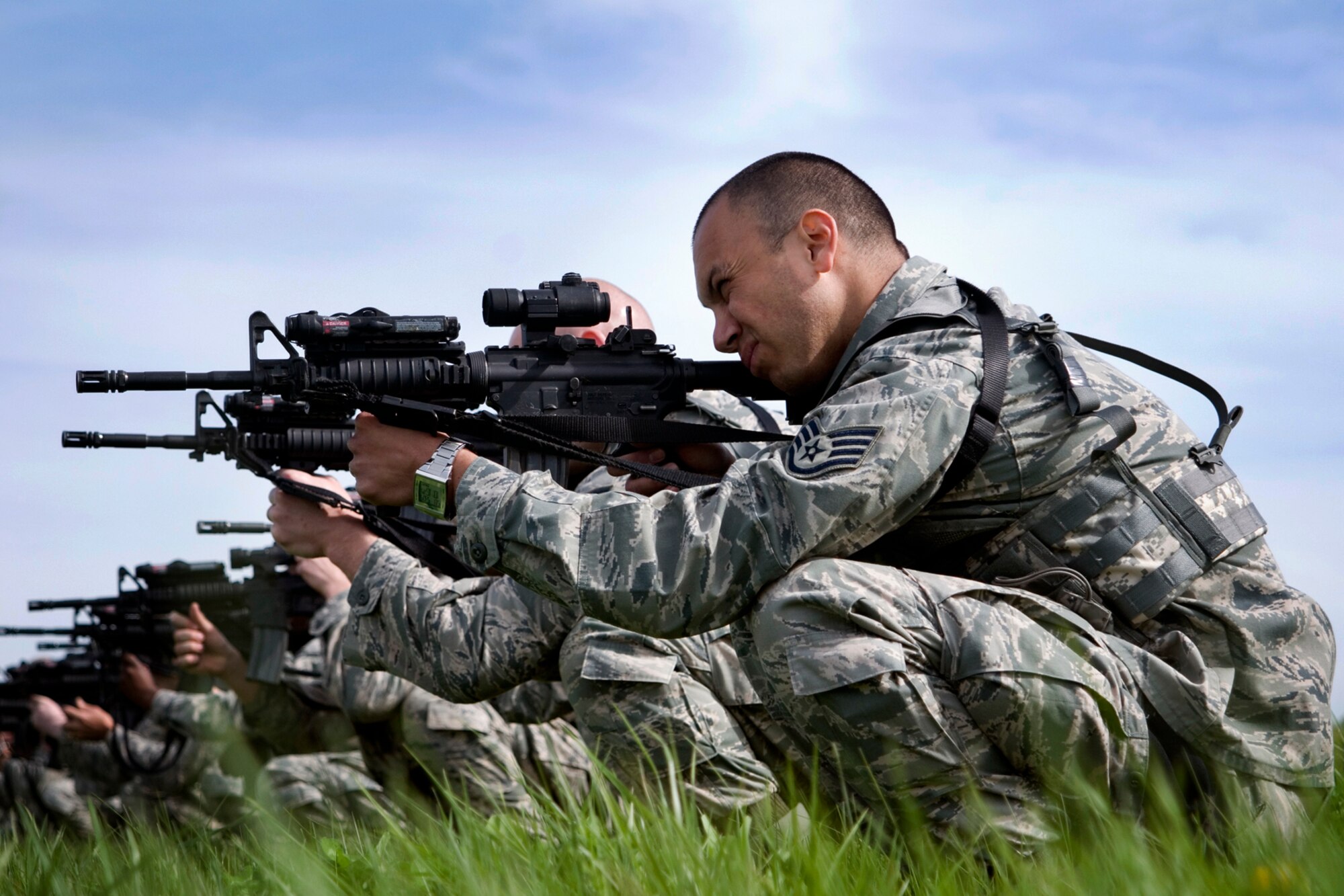 Staff Sgt. Steve Salazar, 434th Security Forces Squadron fire team member, assumes a crouching position while aiming an M-4 rifle during weapons training at Grissom Air Reserve Base, Ind., May 5, 2013. During the training, 434th SFS members practiced handling their weapons effectively in response to threats. (U.S. Air Force photo/Staff Sgt. Andrew McLaughlin)