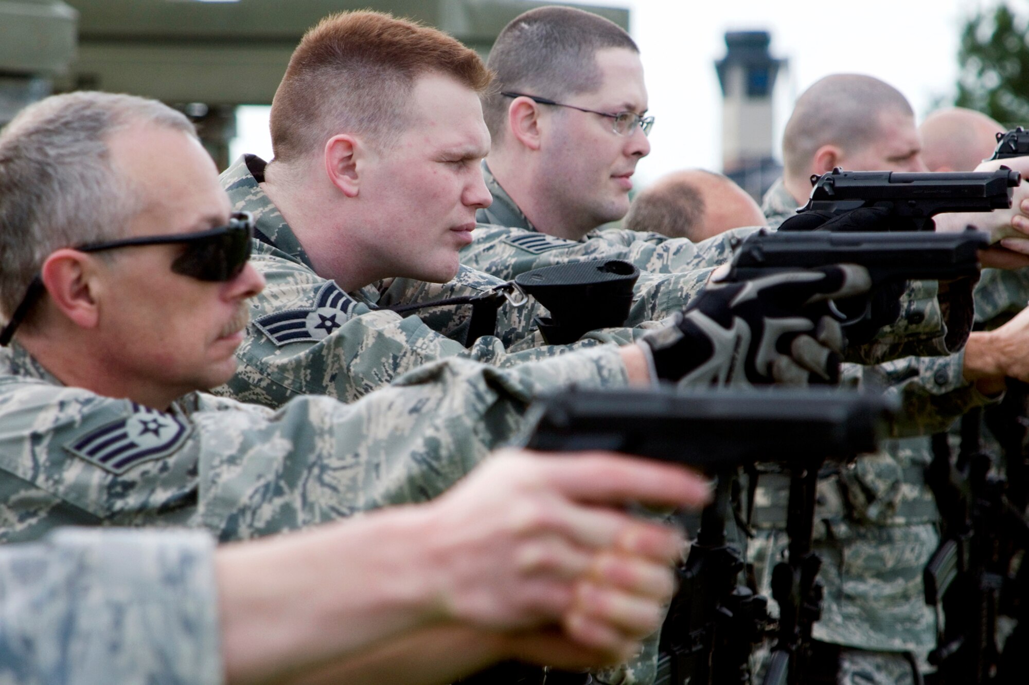 434th Security Forces Squadron Airmen aim M-9 pistols during weapons training at Grissom Air Reserve Base, Ind., May 5, 2013. During the training, 434th SFS members practiced tactical movements and weapon transition drills. (U.S. Air Force photo/Staff Sgt. Andrew McLaughlin)
