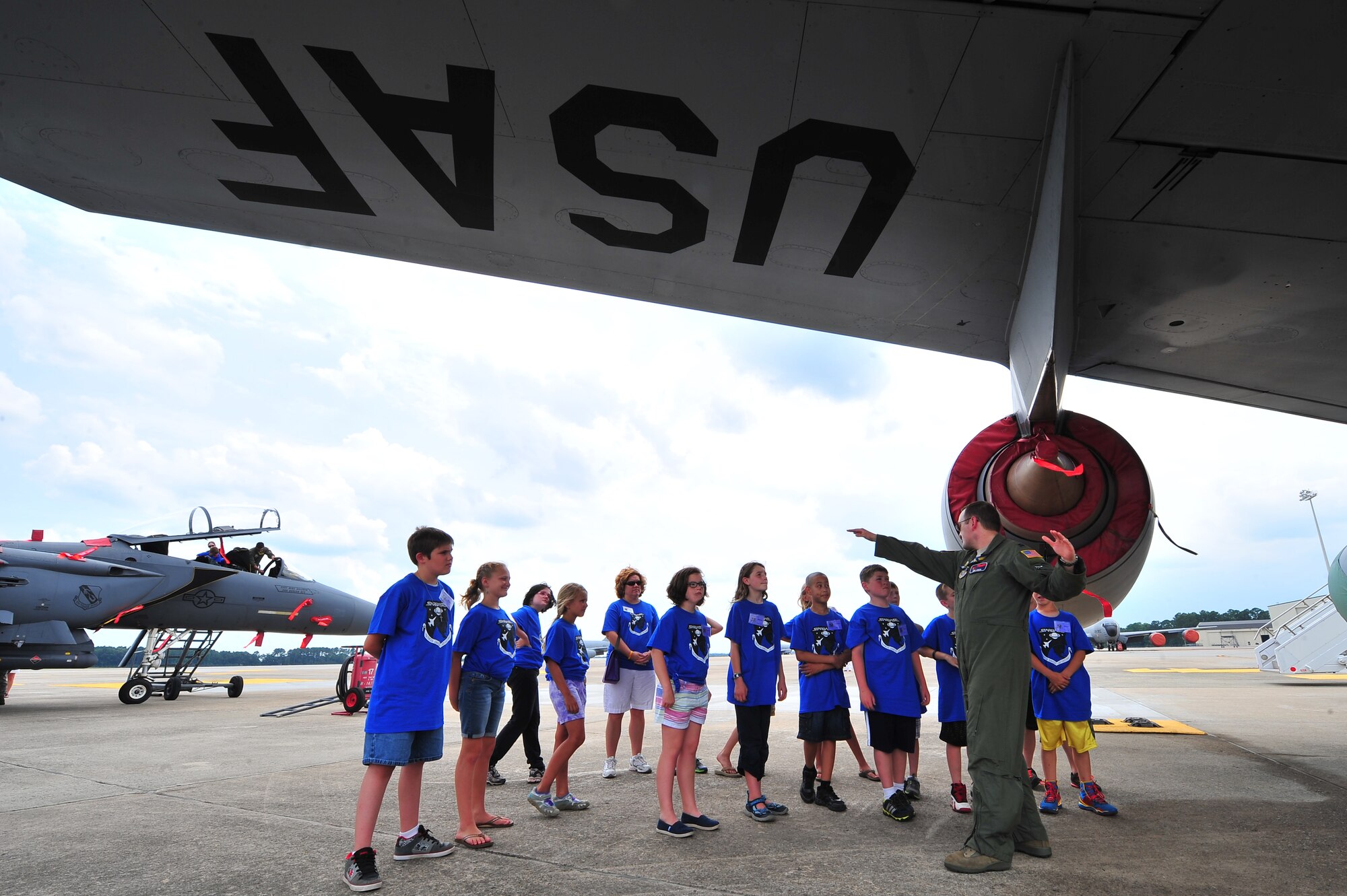 U.S. Air Force Capt. Michael Linger, 911th Air Refueling Squadron, gives fifth graders a tour of a KC-135 Stratotanker as a part of the Science and Technology Academies Reinforcing Basic Aviation and Space Exploration Program on Seymour Johnson Air Force Base, N.C., June 20, 2013. The students visited various places on base to learn about how math and science is used in the Air Force. (U.S. Air Force photo by Senior Airman Aubrey White/Released)