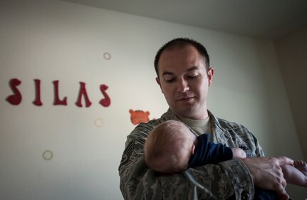 Staff Sgt. Jeremy Staten, 437th Airlift Wing quality assurance inspector, soothes his 1-month old son, Silas, June 18, 2013, inside the baby’s nursery at Joint Base Charleston – Air Base, S.C. Silas was born in the back of a van outside of JB Charleston – Air Base, while Staten, and his wife Cara were on their way to the medical birthing center. (U.S. Air Force Photo / Airman 1st Class Tom Brading)