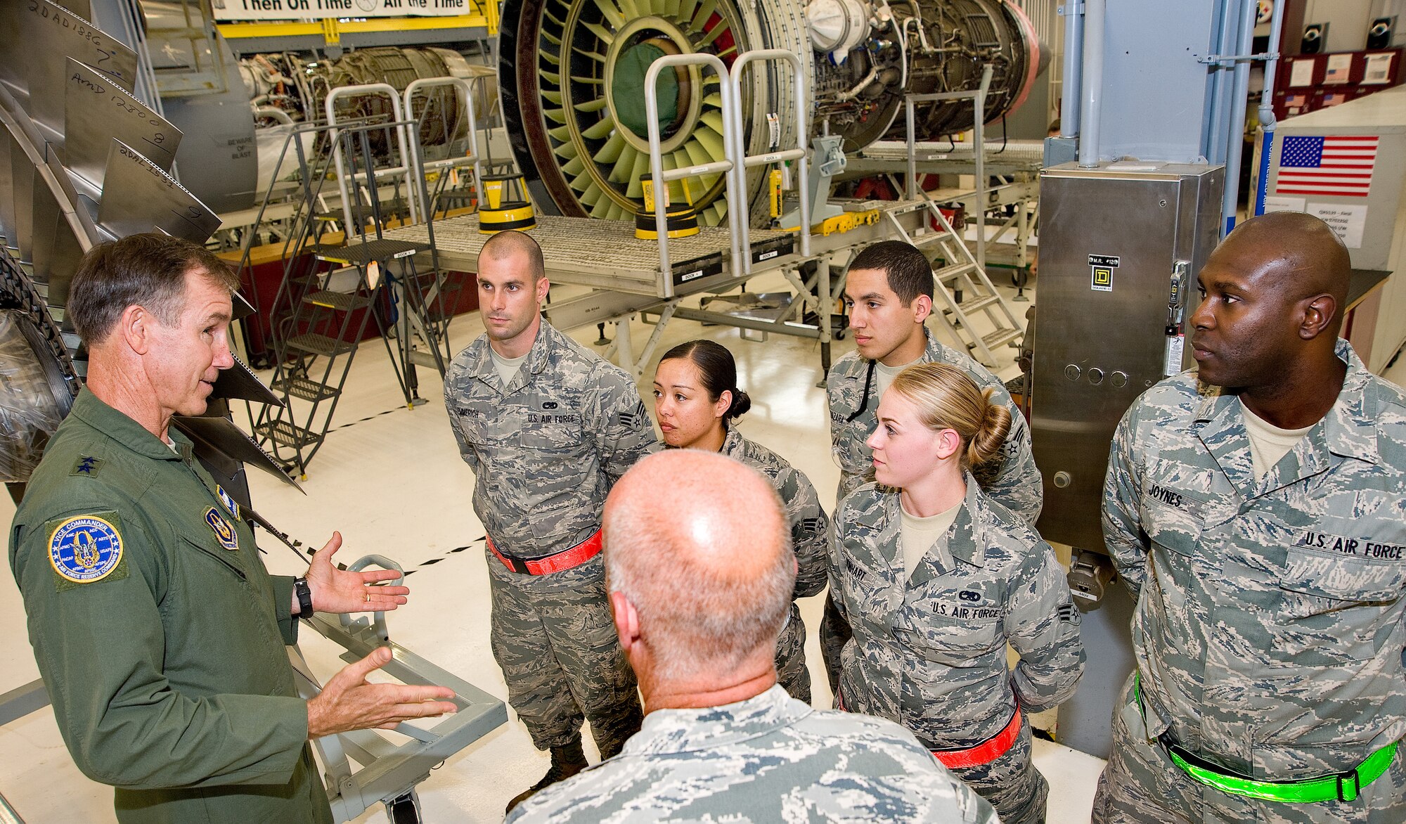 Maj. Gen. Craig N.Gourley, Air Force Reserve Command vice commander, talks with 512th Maintenance Squadron members July 21, 2013, during a tour of the TF-39 Central Repair Facility, Dover Air Force Base, Del. The Airmen talked with Gourley about the Seasoning Training Program, which made it possible for some of them to receive on the job training for 270 days following their formal schooling. (U.S. Air Force photo/Roland Balik)