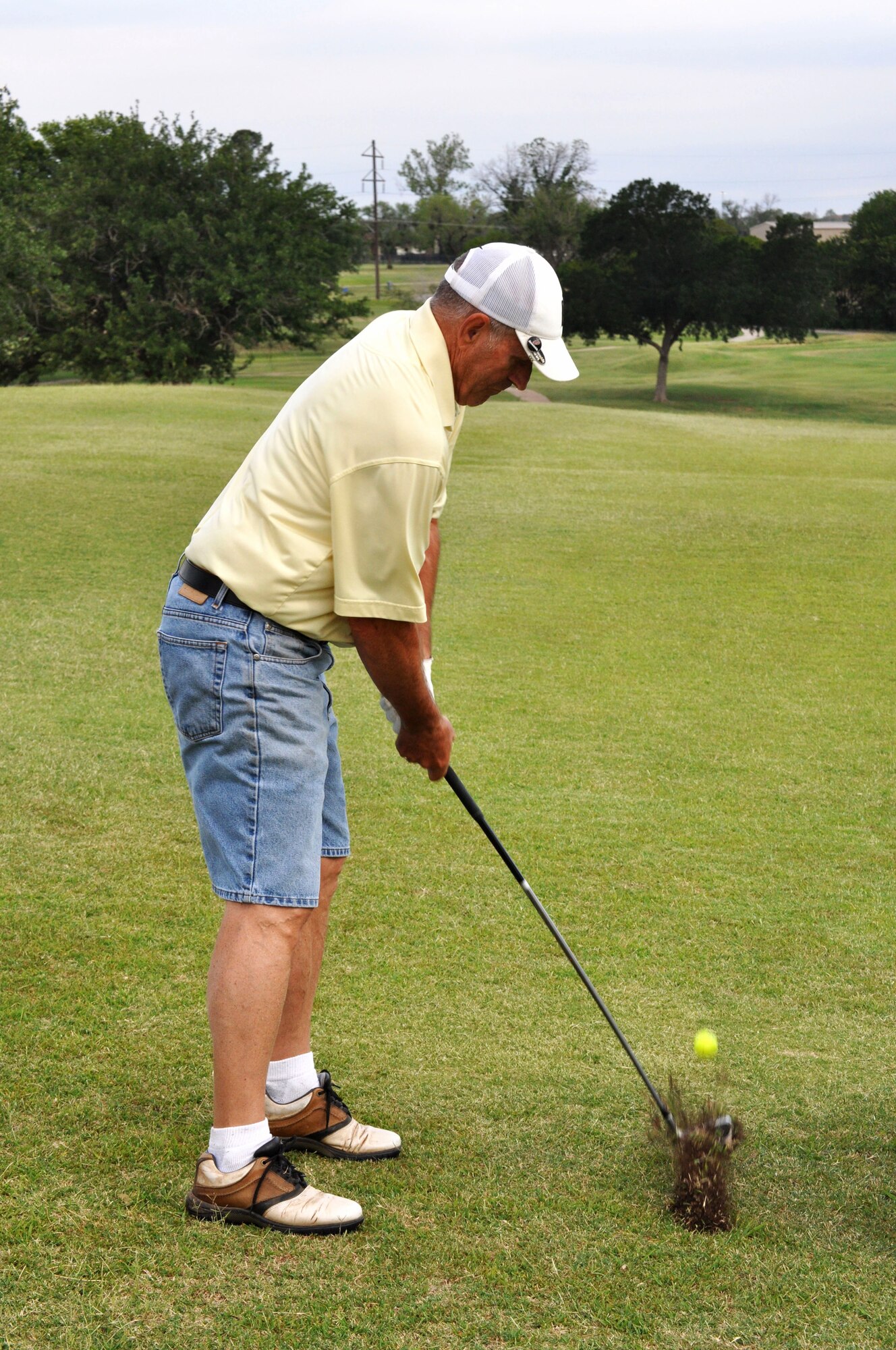 Retired Chief Master Sgt. Ben Slater hits the ball during a round of golf at the Wind Creek Golf Course. (U.S. Air Force Photo/ Kim Goff)