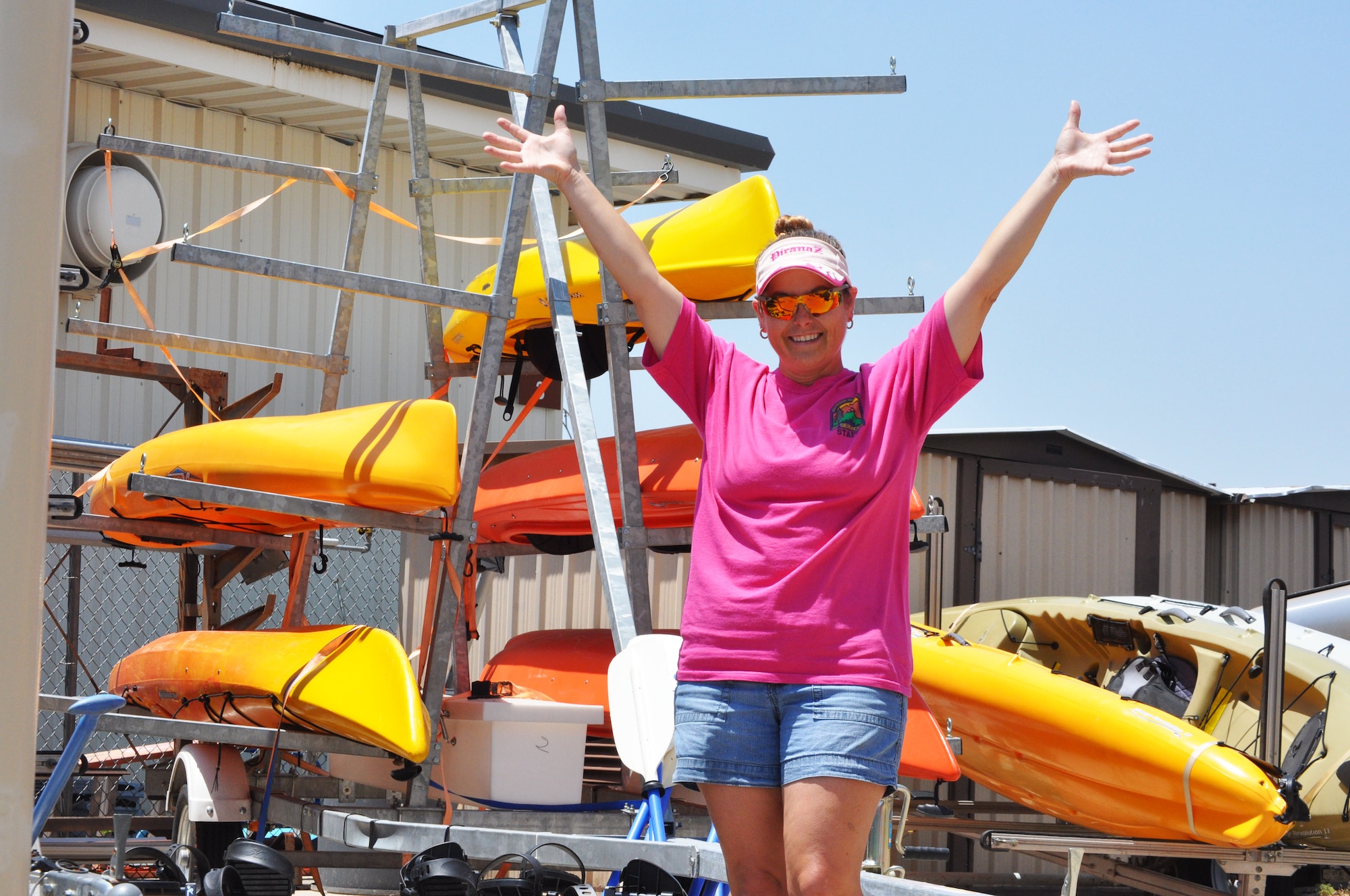 Beth Clements, Director of Outdoor Recreation on Sheppard Air Force Base, proudly shows off some of the equipment she has available for rent. (U.S. Air Force Photo/ Kim Goff