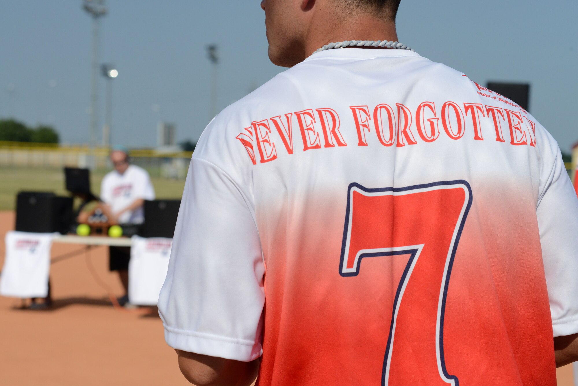 A member of 4 the Fallen Europe prepares for a softball tournament opening day ceremonies June 21, 2013 at Aviano Air Base, Italy. The round-robin softball tournament was hosted by 4 the Fallen Europe; a non-profit organization whose mission is to raise awareness for service members and families who paid the ultimate sacrifice or suffered a life-altering disability while serving. (U.S. Air Force photo/Airman Ryan Conroy) 