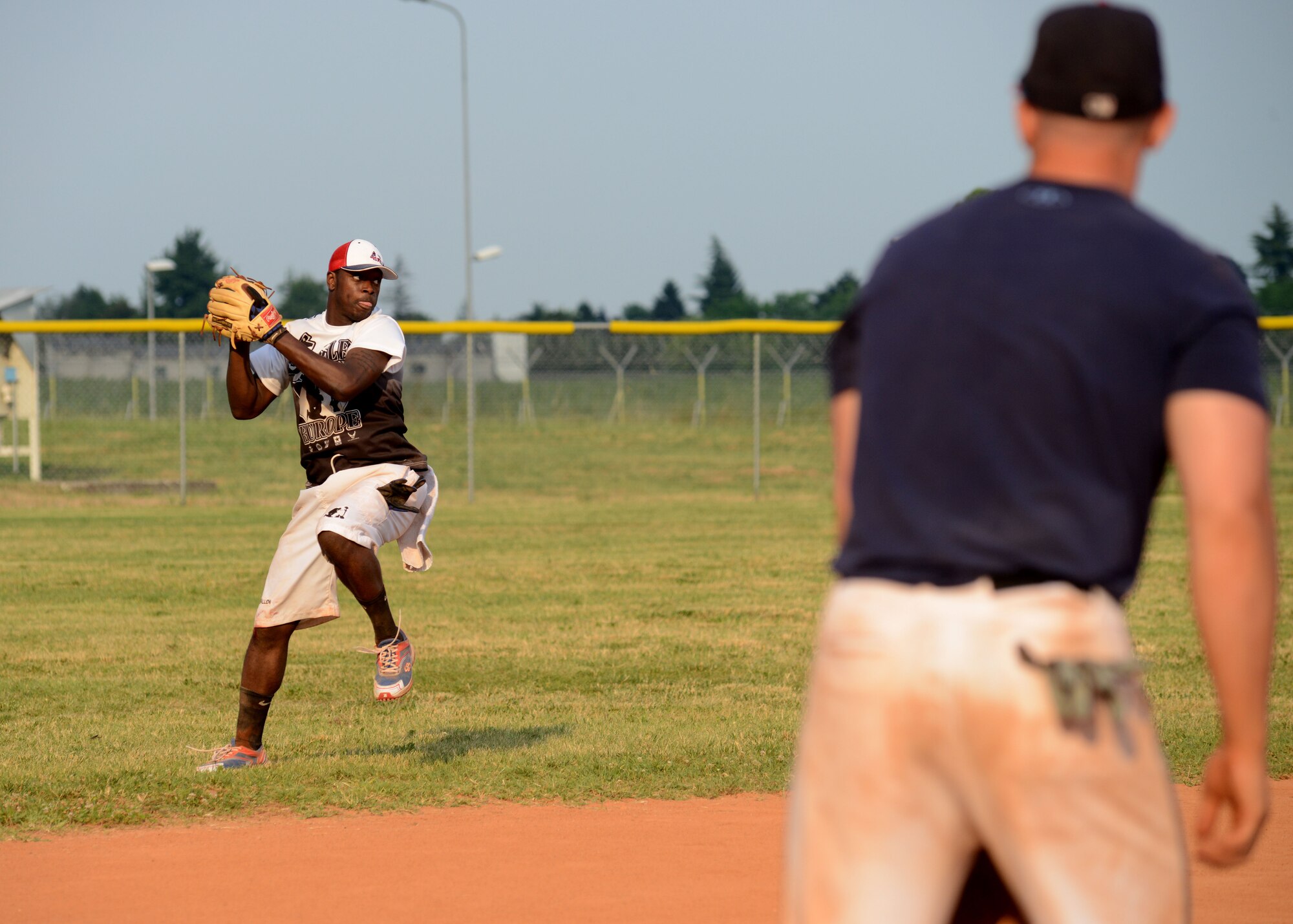 Maurice Jones, relays a throw from the outfield June 21, 2013, at Aviano Air Base Italy. Jones played with the SFS team during a round-robin softball tournament dedicated to the life of Maj. Lucas Gruenther; a fighter pilot assigned 31st Fighter Wing, who crashed during a training mission over the Adriatic Sea Jan. 28, 2013. (U.S. Air Force photo/Airman Ryan Conroy) 