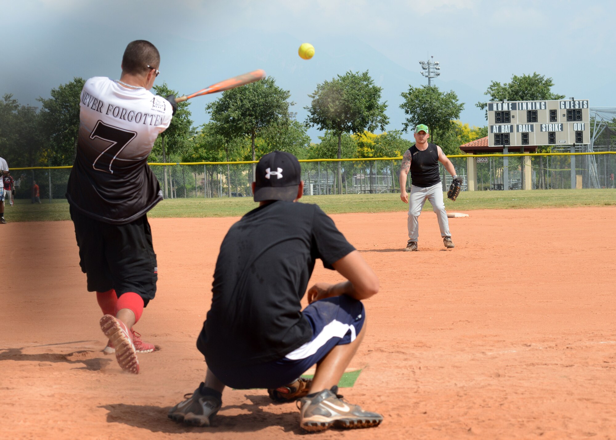 A player on the 31st Munitions Squadron team hits a line drive during a tournament hosted by 4 the Fallen Europe organization June 22, 2013 at Aviano Air Base, Italy. The tournament allowed the organization to raise awareness for service members and families who paid the ultimate sacrifice or suffered a life-altering disability while serving. (U.S. Air Force photo/Airman Ryan Conroy) 