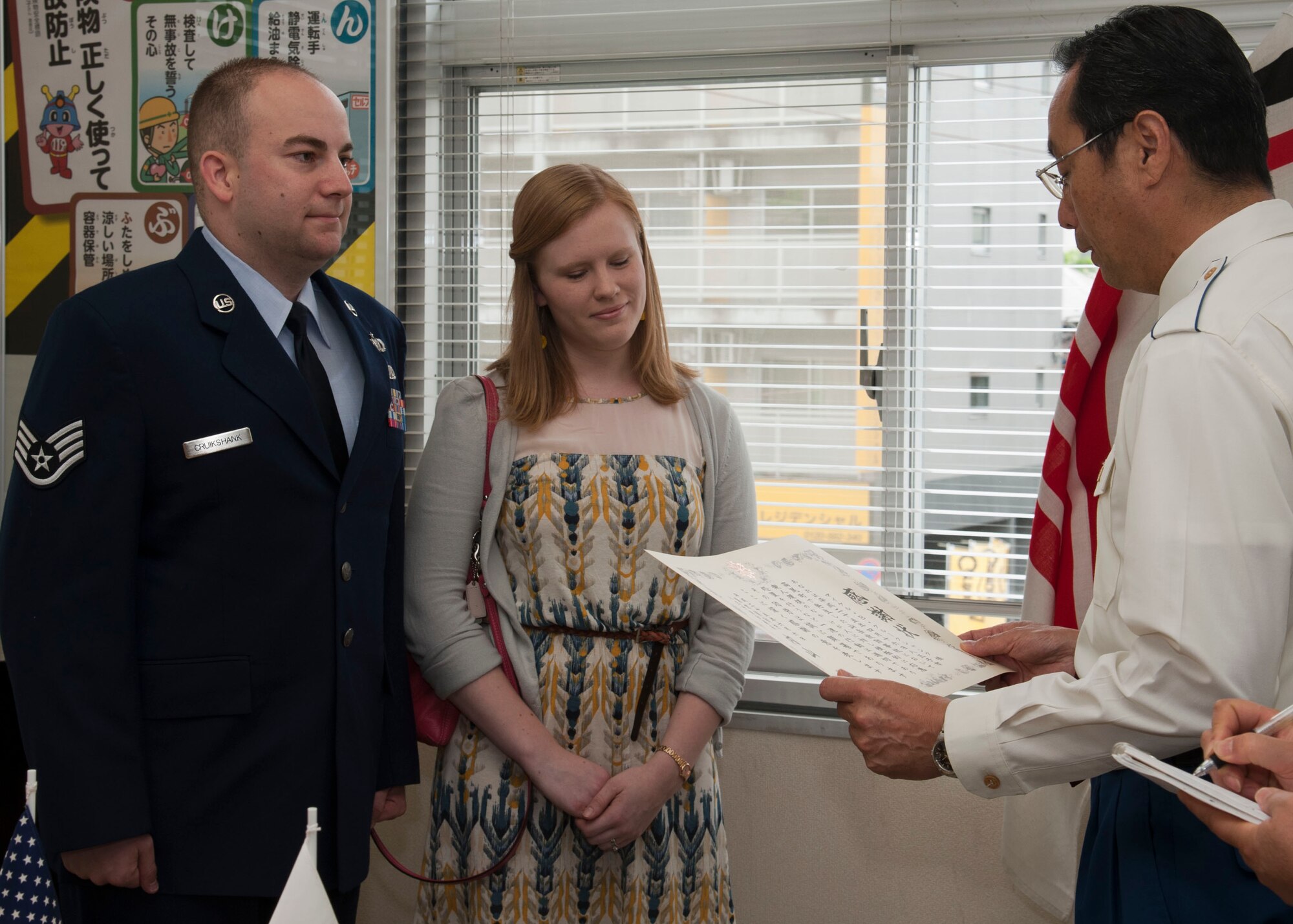 HACHIOJI, Japan – Staff Sgt. Michael Cruikshank, 374 Operation Support Squadron airfield manager, receives an award from the chief of Hachioji Fire Department, Toru Uchiyama, on June 6, 2013, at Hachioji Fire Department.  Cruikshank used his Self Aid Buddy Care skills to save a critically injured hiker in Mt. Takao.  (U.S. Air Force photo by Airman 1st Class Soo C. Kim)