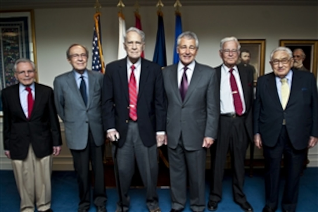 Defense Secretary Chuck Hagel, center right, poses with former defense secretaries, from left, Frank C. Carlucci, William J. Perry, James R. Schlesinger and Harold Brown, and Henry Kissinger, far right, former secretary of state, for a group photo after a meeting of the Defense Policy Board at the Pentagon, June 18, 2013. During the meeting, the leaders discussed the challenges faced by the Defense Department while Hagel received some perspective from his predecessors.  