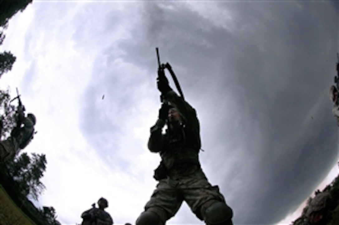U.S. paratroopers engage targets during close-quarter marksmanship training with Indonesian army paratroopers during exercise Garuda Shield 2013 at 1st Kostrad headquarters in West Java, Indonesia, June 10, 2013. The paratroopers are assigned to the 82nd Airborne Division’s 1st Brigade Combat Team.