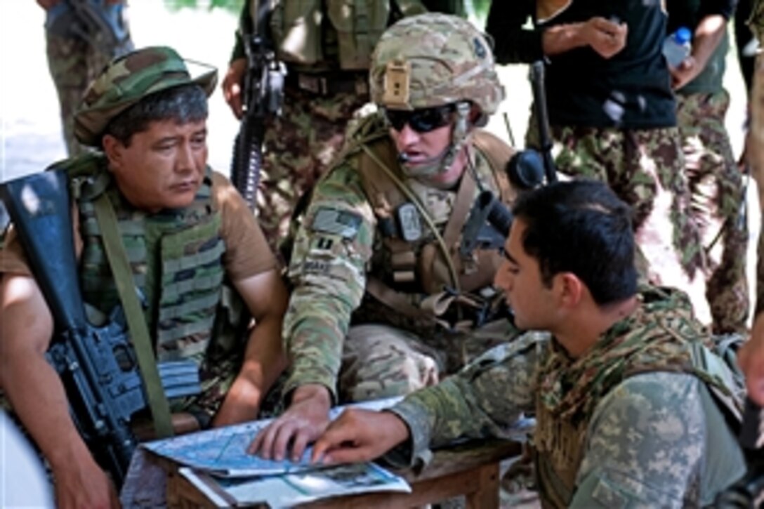 U.S. Army Capt. Nicholas Drake, center, talks with Afghan army Lt. Col. Mohammad Bashir, left, during a patrol break on the outskirts of Takiya Khana village in Bati Kot district in Afghanistan’s Nangarhar province, June 15, 2013. Drake is commander of the 101st Airborne Division's Security Forces Advisory and Assistance Team Archangel, 1st Battalion, 327th Infantry Regiment, 1st Brigade Combat Team.