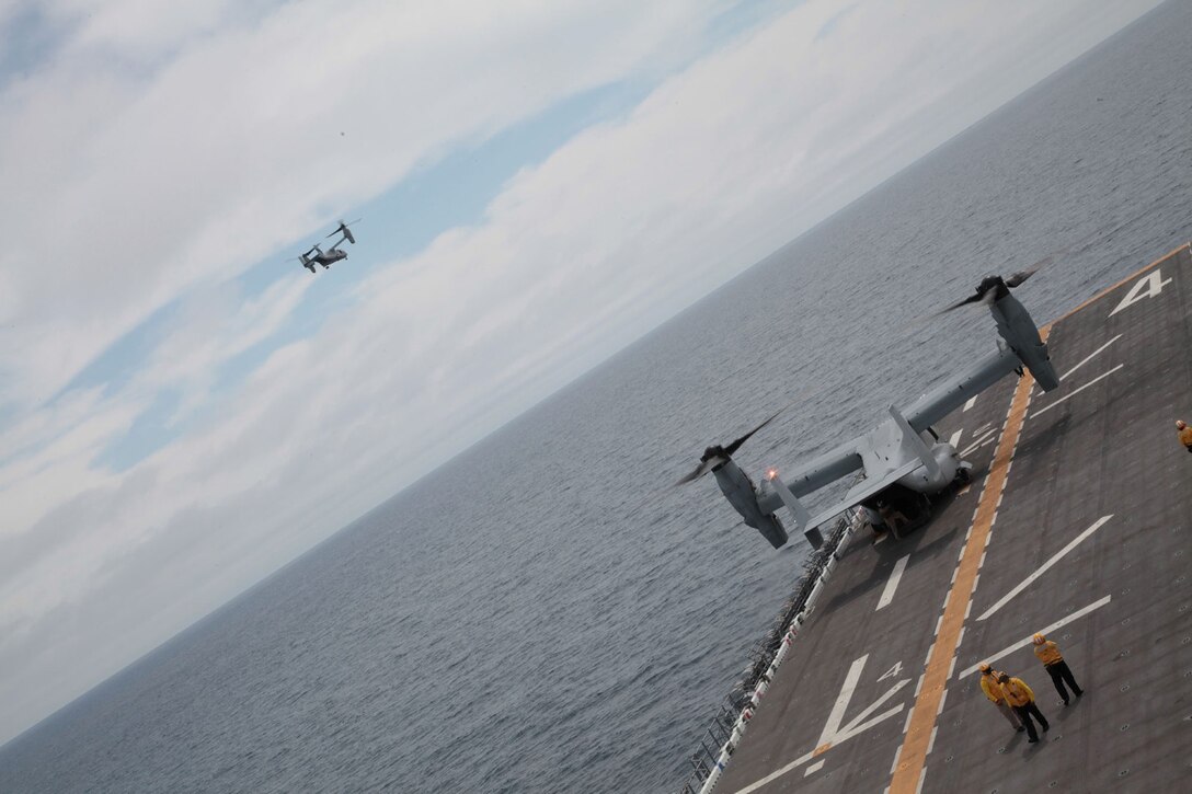 U.S. Marine Corps VM-22B Ospreys with Marine Medium Tiltrotor Squadron 166 Reinforced (VMM- 166 (REIN)), 13th Marine Expeditionary Unit land aboard the USS Boxer (LHD-4) June 11, 2013 during PHIBRON-MEU Integration (PMINT). PMINT is a three week long pre-deployment training event focusing on the combined Marine Expeditionary Unit and Amphibious Ready Group capabilities and the strengthening of the Navy and Marine Corps team. (U.S. Marine Corps photo by Lance Cpl. David Gonzalez, 13th Marine Expeditionary Unit Combat Camera/ Released)