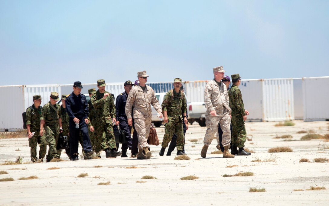 130617-M-OH054-188
SAN CLEMENTE ISLAND, Calif.  – Staff with I Marine Expeditionary Force and members of the Japan Self Defense Force observe troop movement during an airfield seizure mission as part of Exercise Dawn Blitz 2013 and PHIBRON-MEU Integration on San Clemente Island, Calif., June 17, 2013. PMINT is a three week long pre-deployment training event focusing on the combined Marine Expeditionary Unit and Amphibious Ready Group capabilities and the strengthening of the Navy and Marine Corps team. (Official U.S. Marine Corps photo by Sgt. Christopher O’Quin/Released)