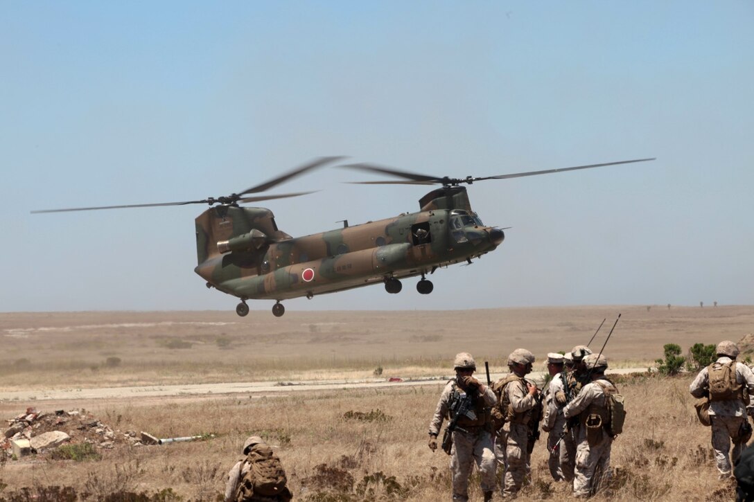 130617-M-OH054-295
SAN CLEMENTE ISLAND, Calif.  – Aircrews with Japan Self Defense Force prepare to extract JSDF troops in CH-47 helicopters during an airfield seizure mission as part of Exercise Dawn Blitz 2013 and PHIBRON-MEU Integration on San Clemente Island, Calif., June 17, 2013. PMINT is a three week long pre-deployment training event focusing on the combined Marine Expeditionary Unit and Amphibious Ready Group capabilities and the strengthening of the Navy and Marine Corps team. (Official U.S. Marine Corps photo by Sgt. Christopher O’Quin/Released)