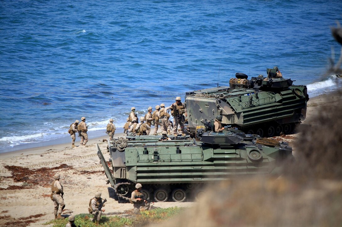 U.S. Marines with Battalion Landing Team 1/4, 13th Marine Expeditionary Unit, conduct an amphibious assault during PHIBRON MEU Integration at Green Beach, Calif., June 23, 2013. PMINT is a three week long pre-deployment training event focusing on the combined Marine Expeditionary Unit and Amphibious Ready Group capabilities and the strengthening of the Navy and Marine Corps team.