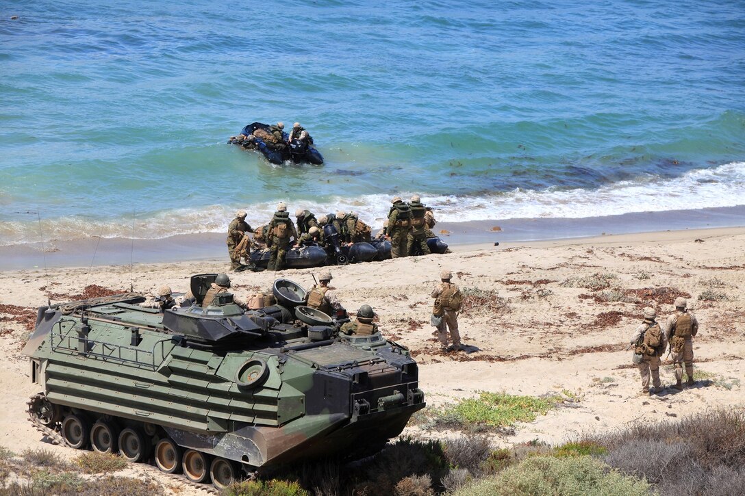 U.S. Marines with Battalion Landing Team 1/4, 13th Marine Expeditionary Unit, conduct an amphibious assault during PHIBRON MEU Integration at Green Beach, Calif., June 23, 2013. PMINT is a three week long pre-deployment training event focusing on the combined Marine Expeditionary Unit and Amphibious Ready Group capabilities and the strengthening of the Navy and Marine Corps team.