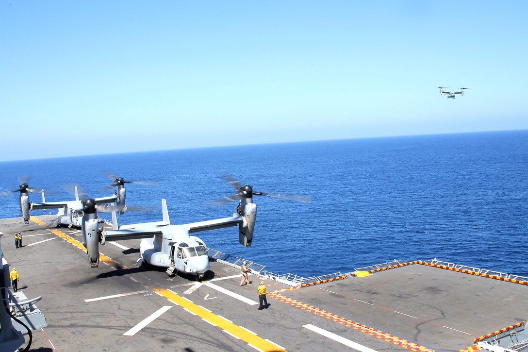 MV-22 Osprey helicopters with Marine Medium Tiltrotor Squadron 166 Reinforced (VMM- 166 (REIN)), 13th Marine Expeditionary Unit, stage aboard the USS Boxer during Amphibious Squadron MEU Integration Training June 19, 2013. PMINT is a three week long pre-deployment training event focusing on the combined Marine Expeditionary Unit and Amphibious Ready Group capabilities and the strengthening of the Navy and Marine Corps team. (U.S. Marine Corps photo by Sgt. Jennifer J. Pirante, 13th Marine Expeditionary Unit Combat Correspondent/ Released)